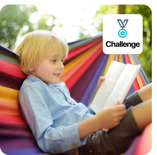Image of boy reading a book in a colorful hammock