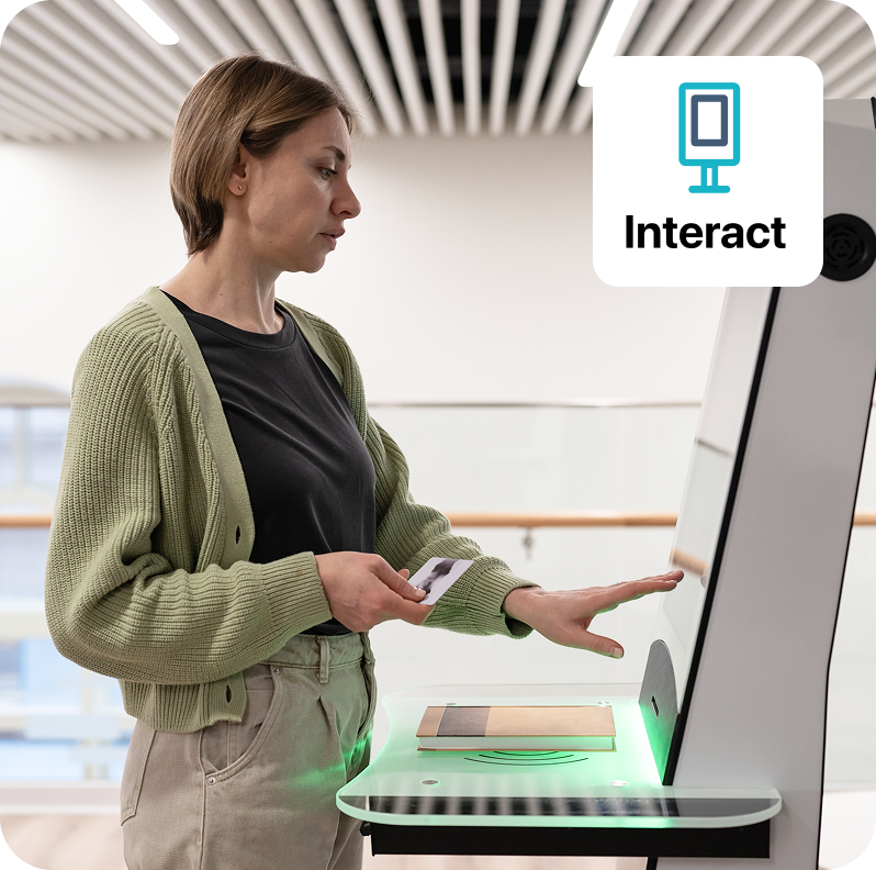image of customer using interact device at a library
