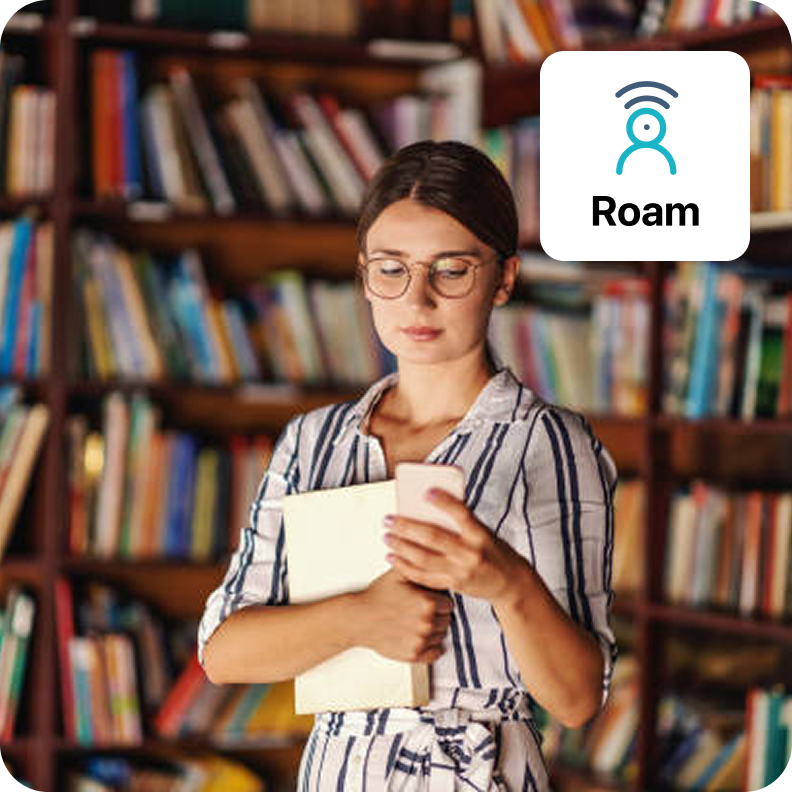 image of librarian checking roam in a library